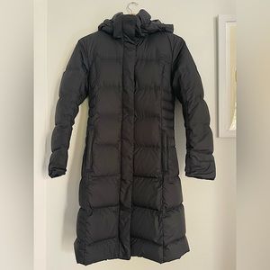 Patagonia women’s black down parka. Size XS.